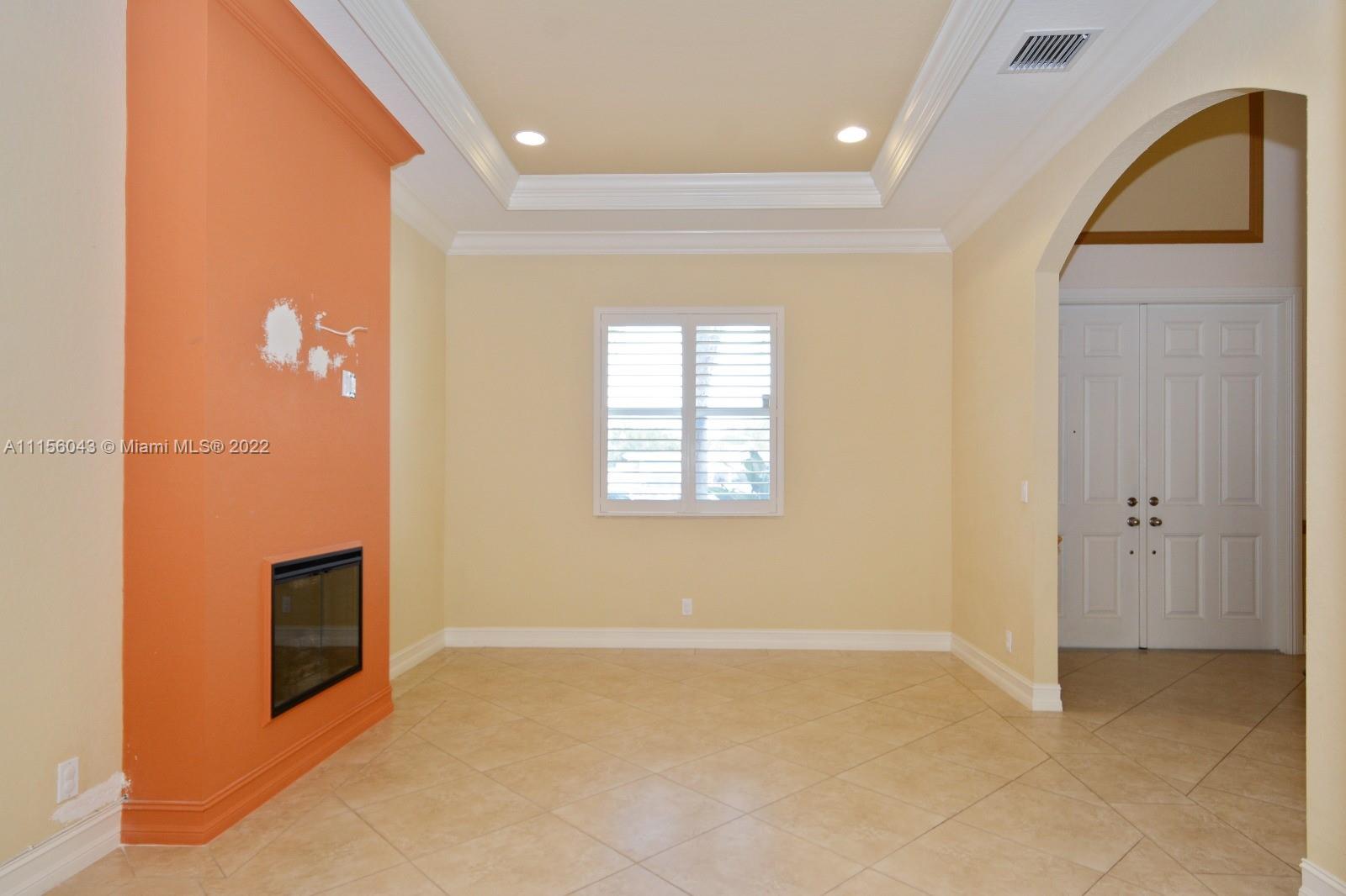 1960 Northeast 33rd Street Lighthouse Point, FL 33064 - Photo 11 of 24 a view of an empty room with a fireplace