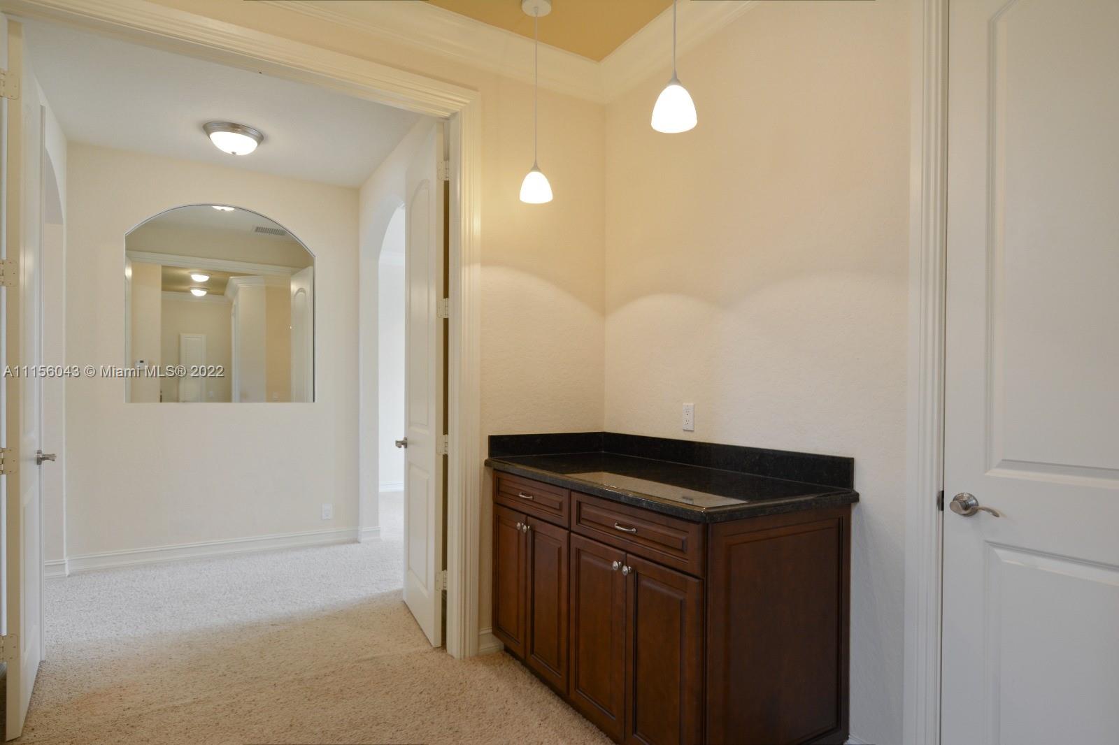 1960 Northeast 33rd Street Lighthouse Point, FL 33064 - Photo 12 of 24 a view of walk in closet