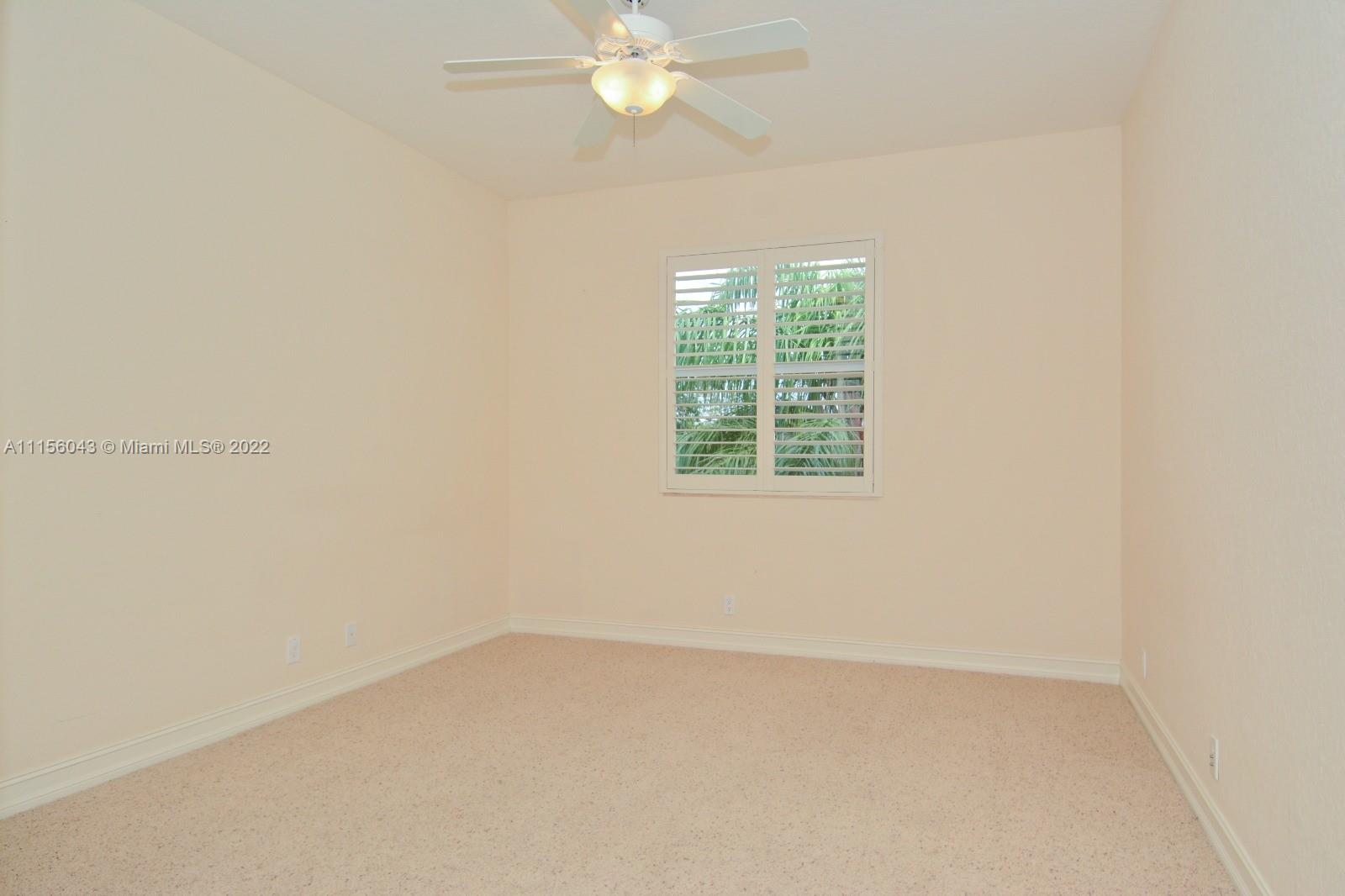 1960 Northeast 33rd Street Lighthouse Point, FL 33064 - Photo 16 of 24 an empty room with a window