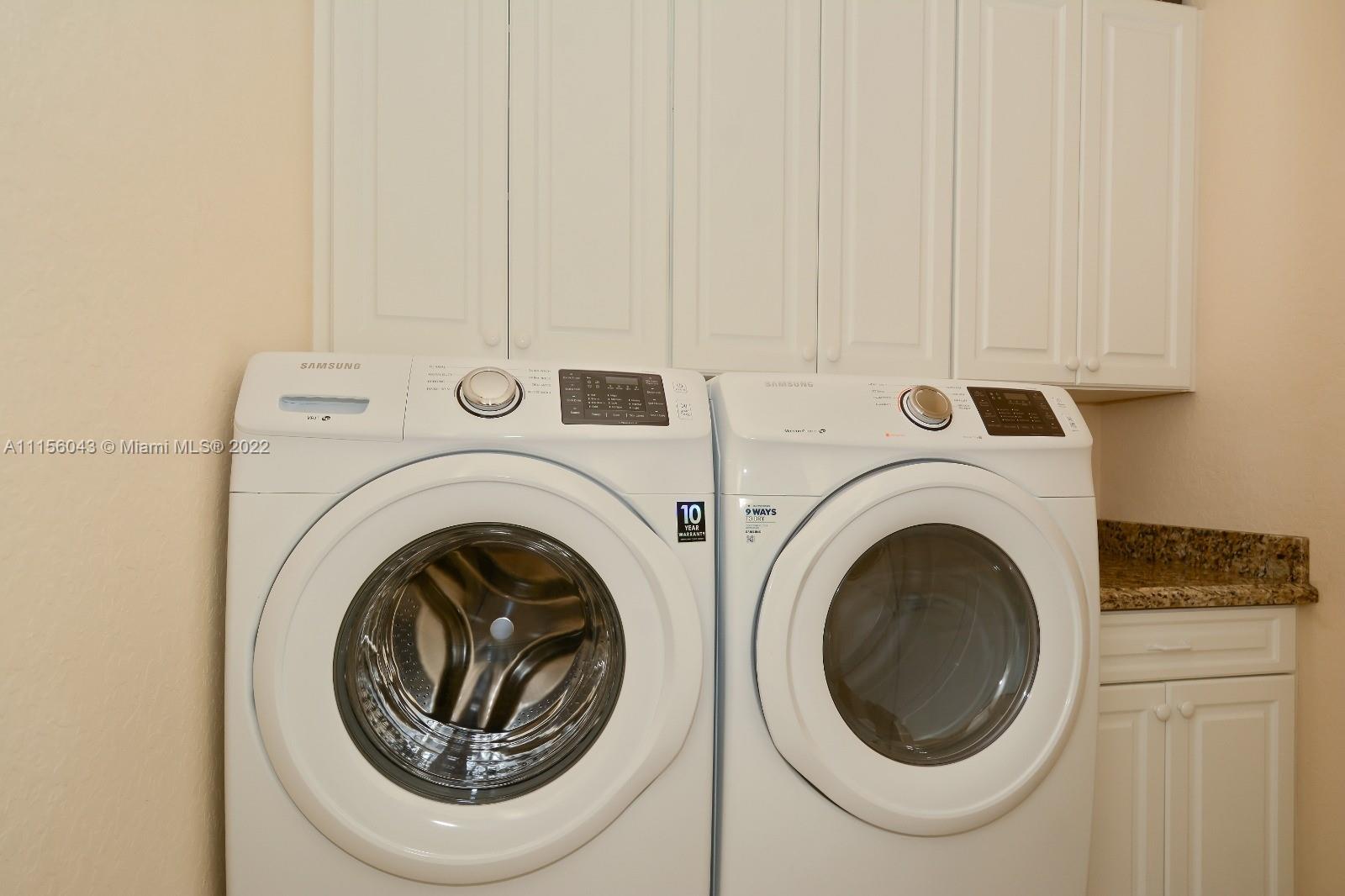 1960 Northeast 33rd Street Lighthouse Point, FL 33064 - Photo 21 of 24 a utility room with dryer and washer