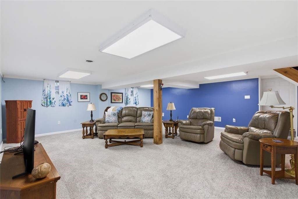 1505 4th Street Monongahela, PA 15063 - Photo 26 of 40 a living room with furniture gym equipment and a flat screen tv