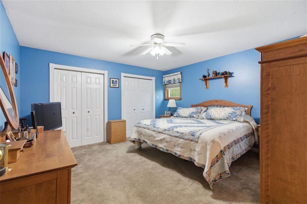 1505 4th Street Monongahela, PA 15063 - Photo 27 of 40 a bedroom with a bed and a chandelier