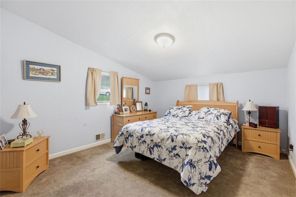 1505 4th Street Monongahela, PA 15063 - Photo 34 of 40 a bedroom with a bed and a night stand