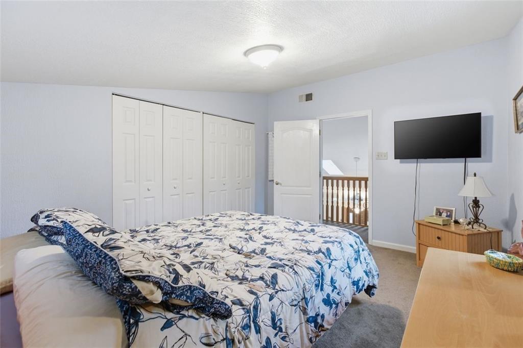 1505 4th Street Monongahela, PA 15063 - Photo 35 of 40 a bedroom with a bed and a flat screen tv