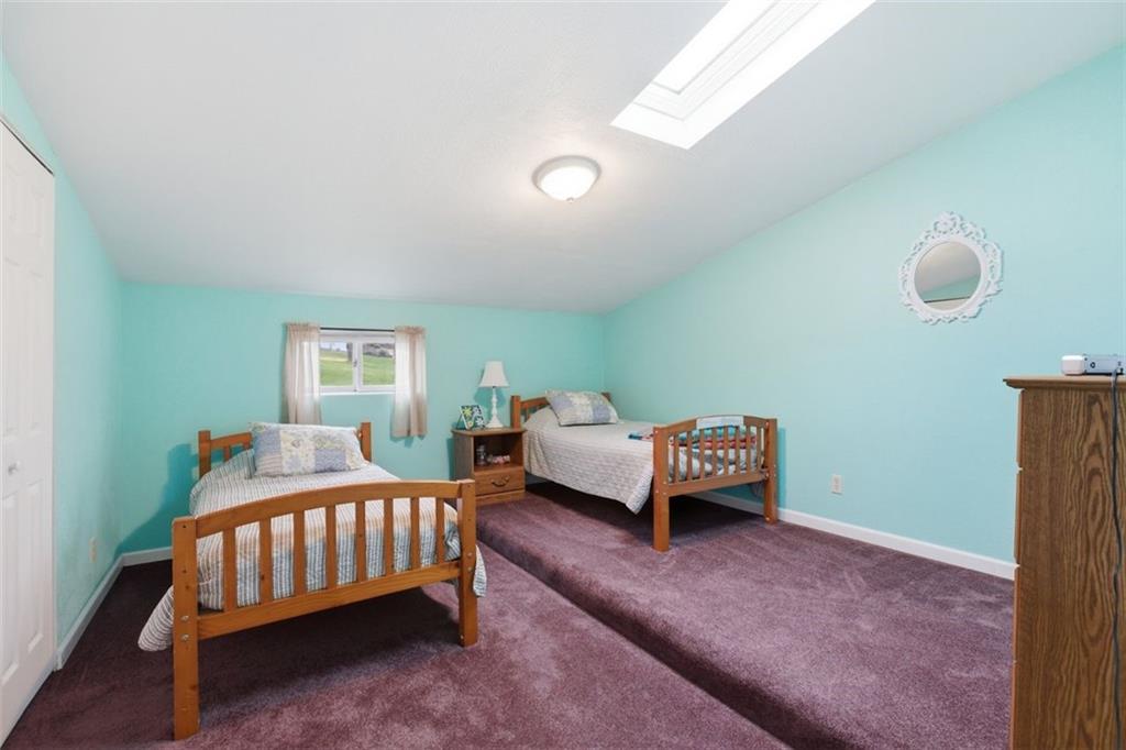 1505 4th Street Monongahela, PA 15063 - Photo 36 of 40 a bedroom with a bed and a chandelier