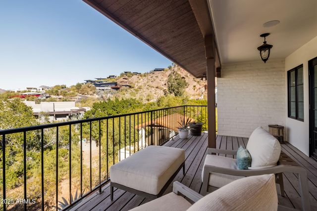 a view of balcony with furniture