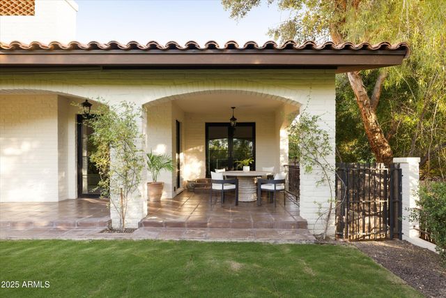 an outdoor view of swimming pool with a yard