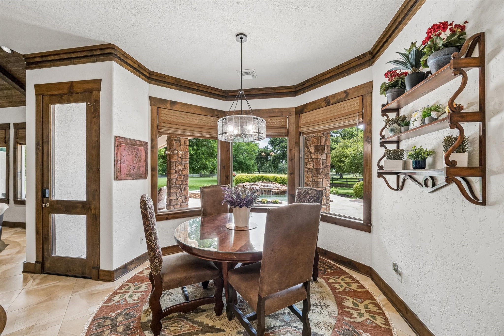 32102 Fulbrook Commons Fulshear, TX 77441 - Photo 7 of 50 Surrounded by backyard views, the breakfast area offers a bright and inviting place to start the day.