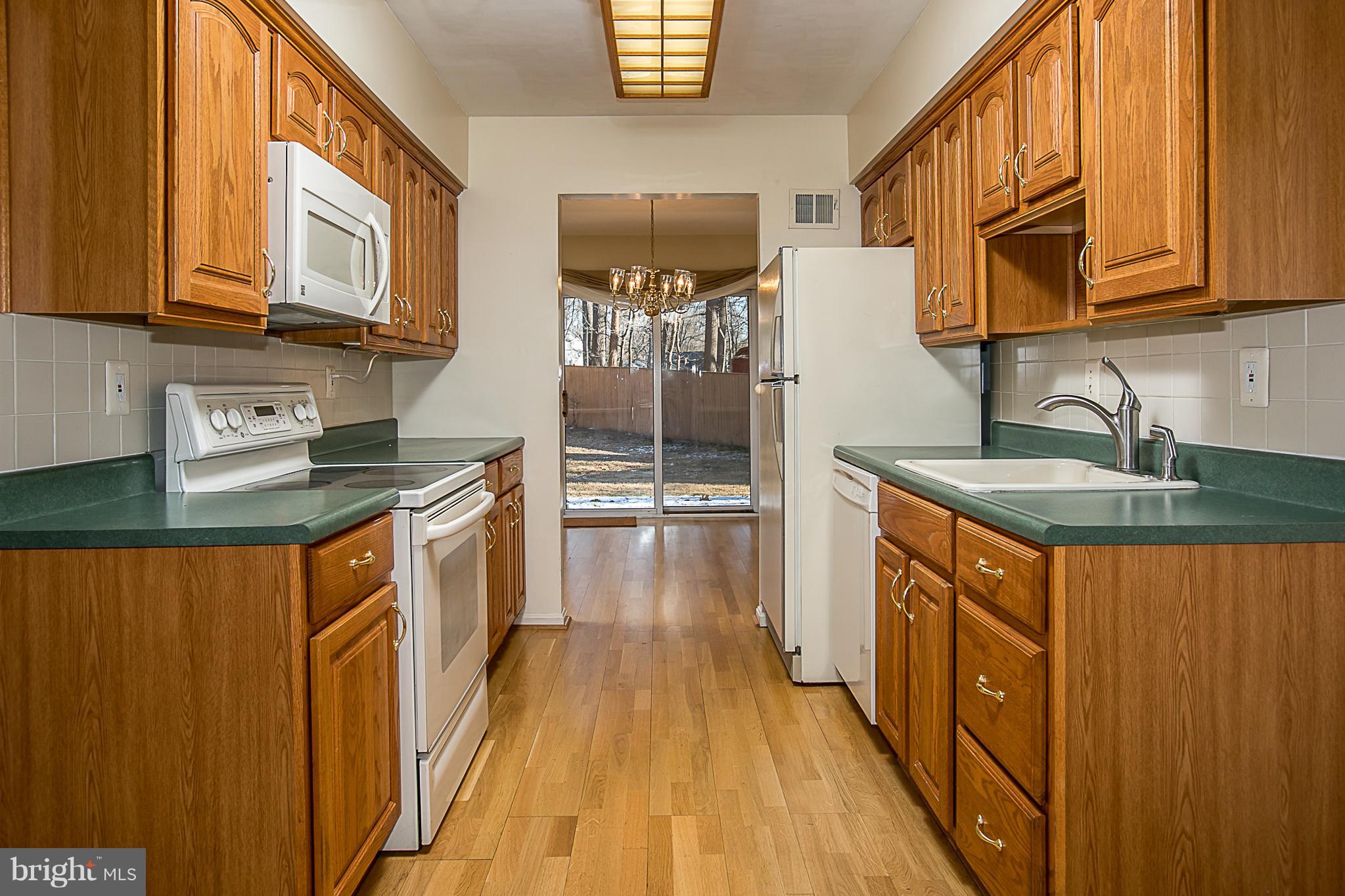 6210 Roblynn Road Laurel, MD 20707 - Photo 9 of 29 Kitchen w/Almond Appliances