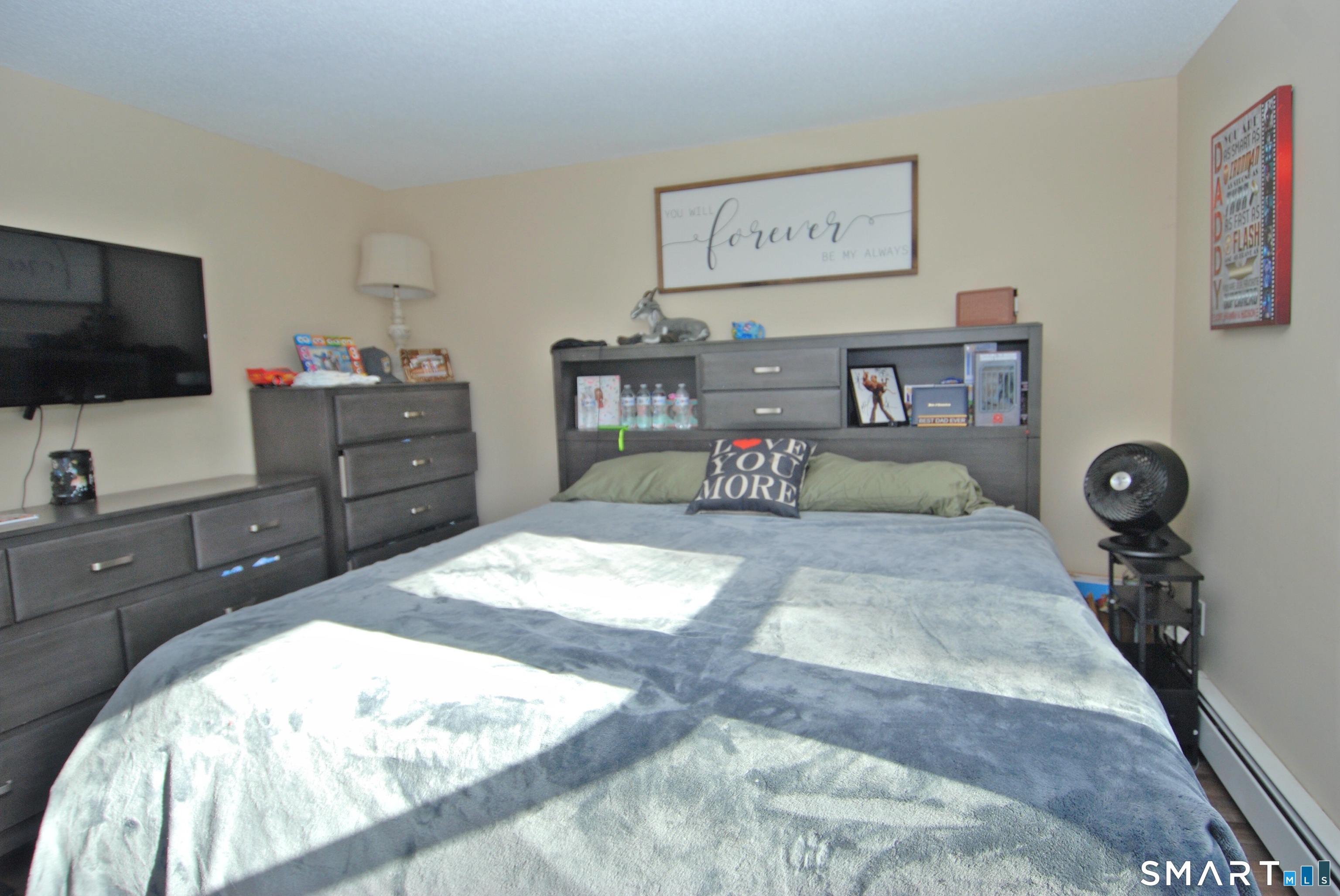 321 Greens Loop, Unit 321 Cheshire, CT 06410 - Photo 12 of 24 a bed room with a bed and a television