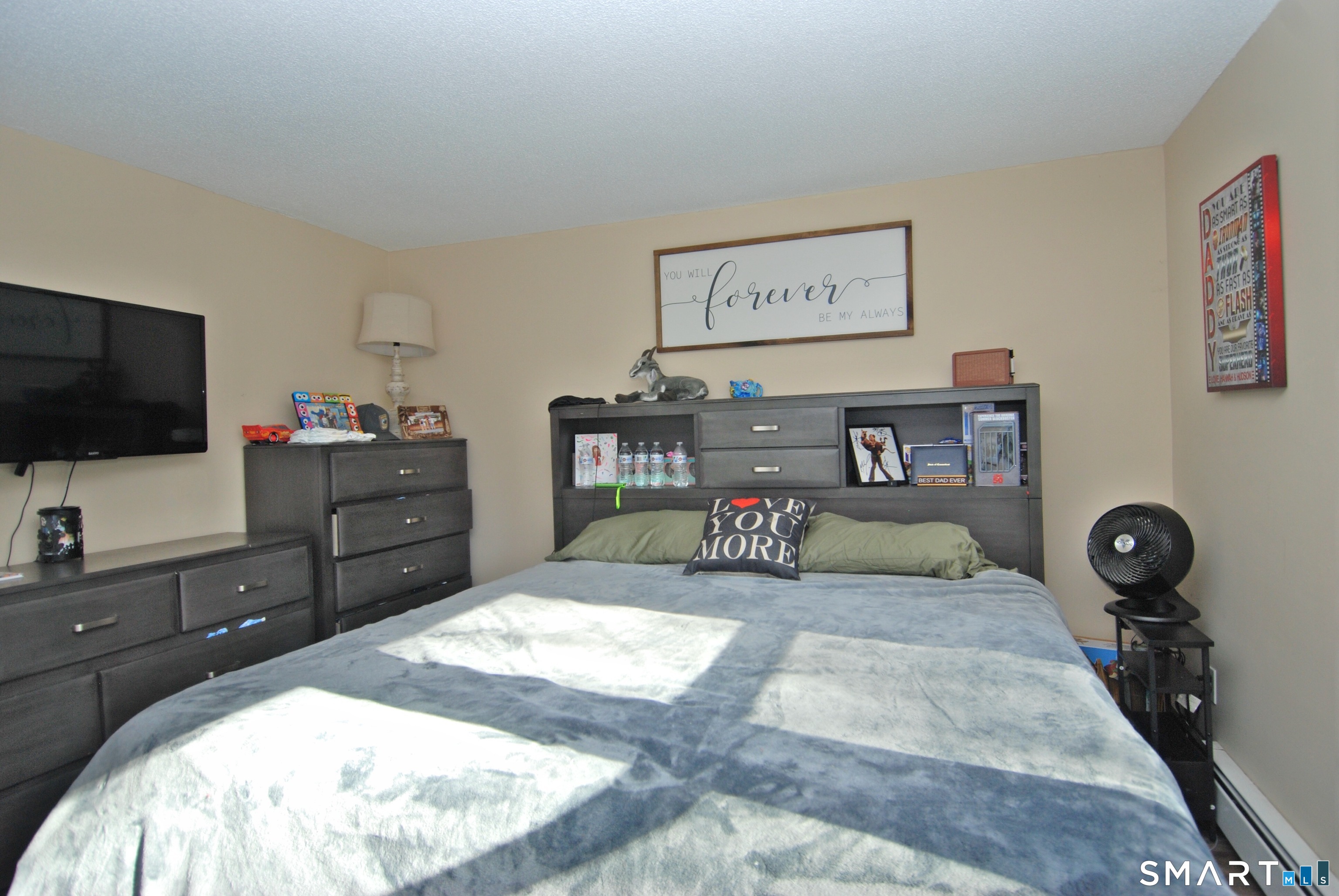 321 Greens Loop, Unit 321 Cheshire, CT 06410 - Photo 13 of 24 a bedroom with a bed and flat screen tv