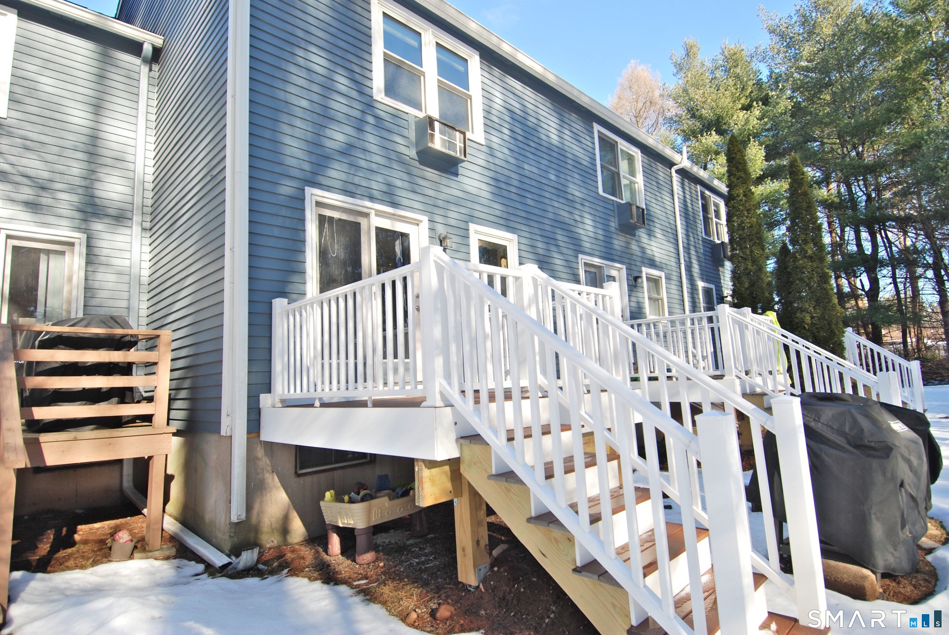 321 Greens Loop, Unit 321 Cheshire, CT 06410 - Photo 22 of 24 a view of wooden house with a large window and wooden floor