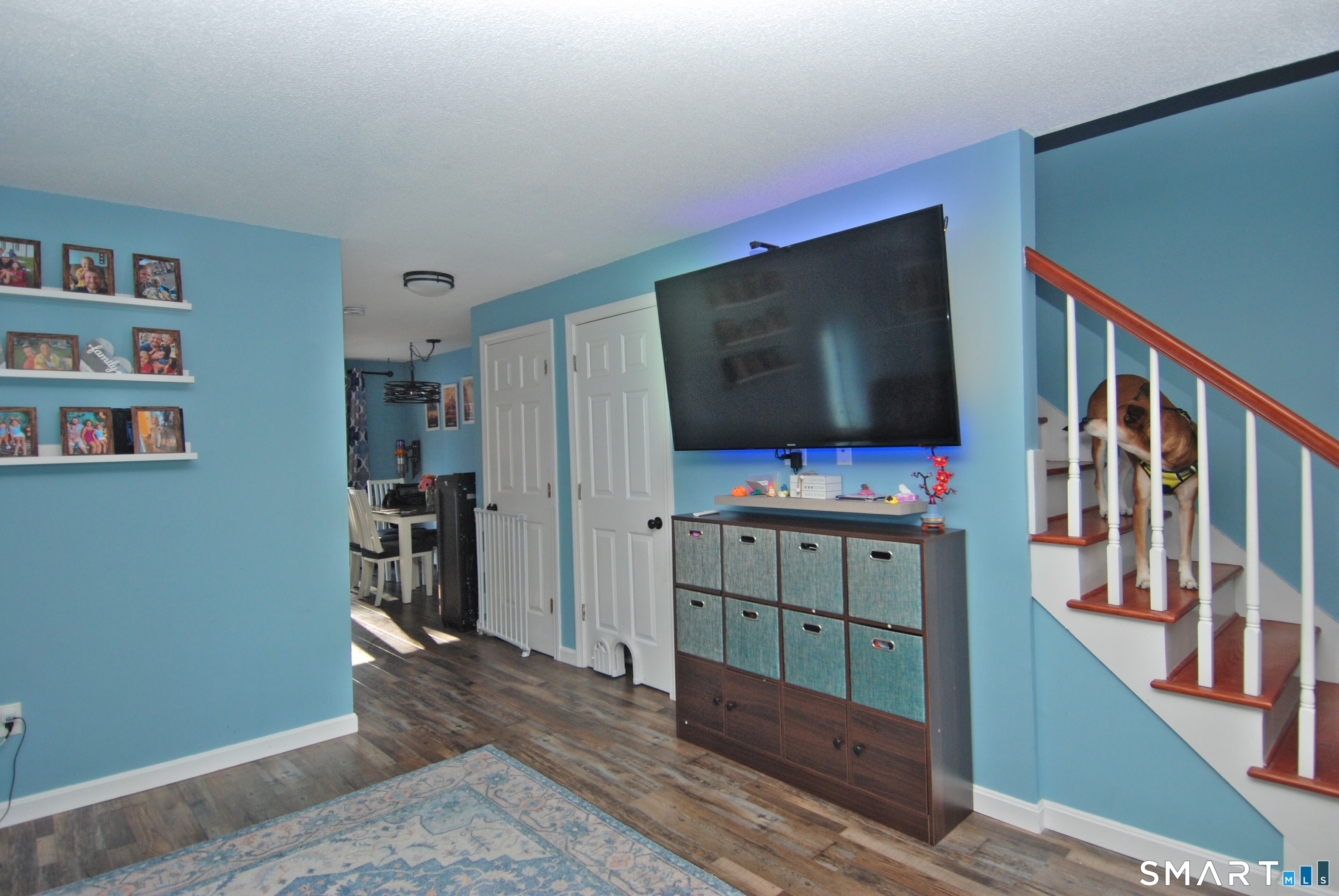 321 Greens Loop, Unit 321 Cheshire, CT 06410 - Photo 3 of 24 a room with furniture and flat screen tv