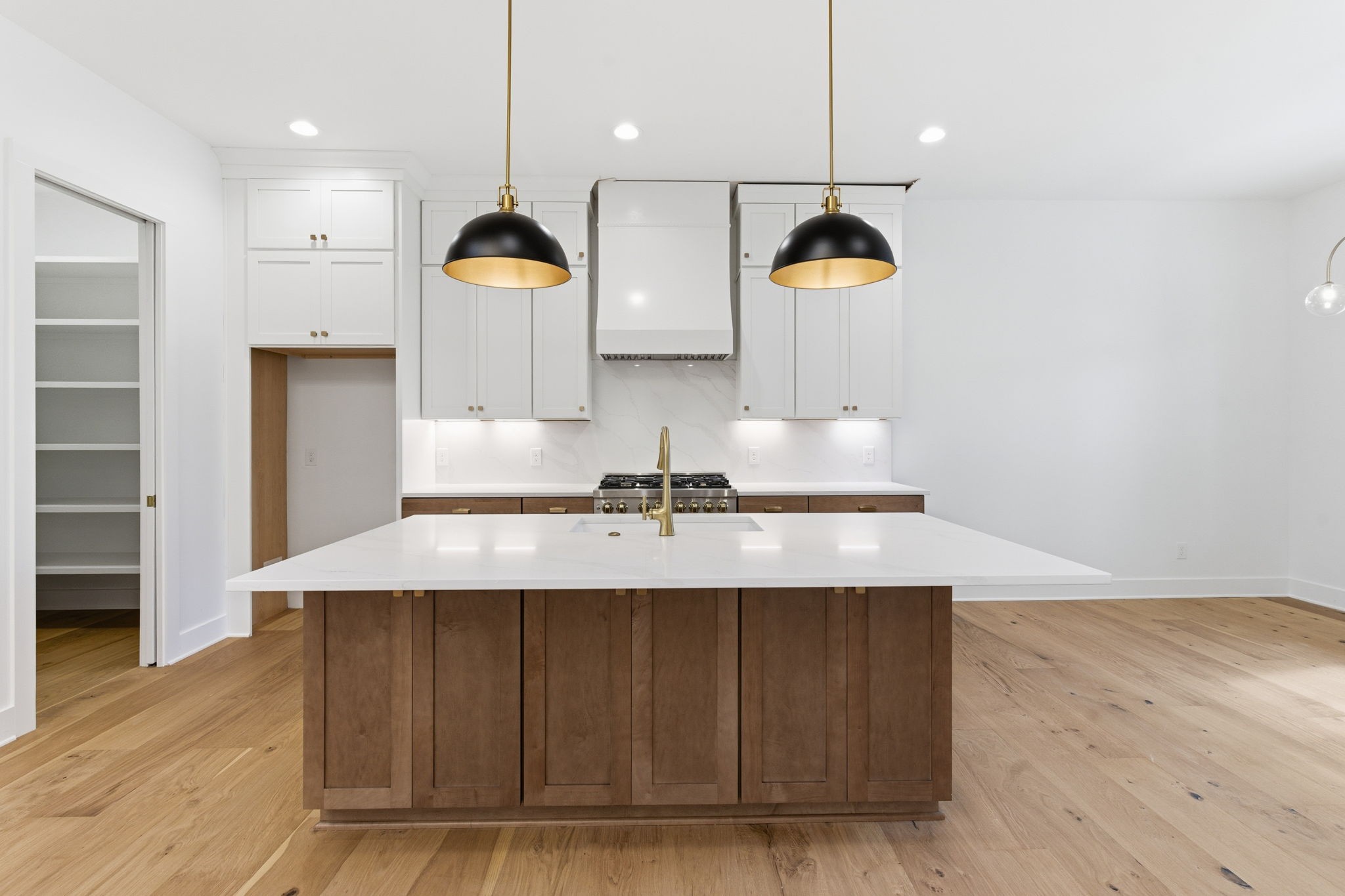 478 Mt Pleasant Road Kingston Springs, TN 37082 - Photo 13 of 59 a kitchen with kitchen island granite countertop a stove a sink and a wooden floors