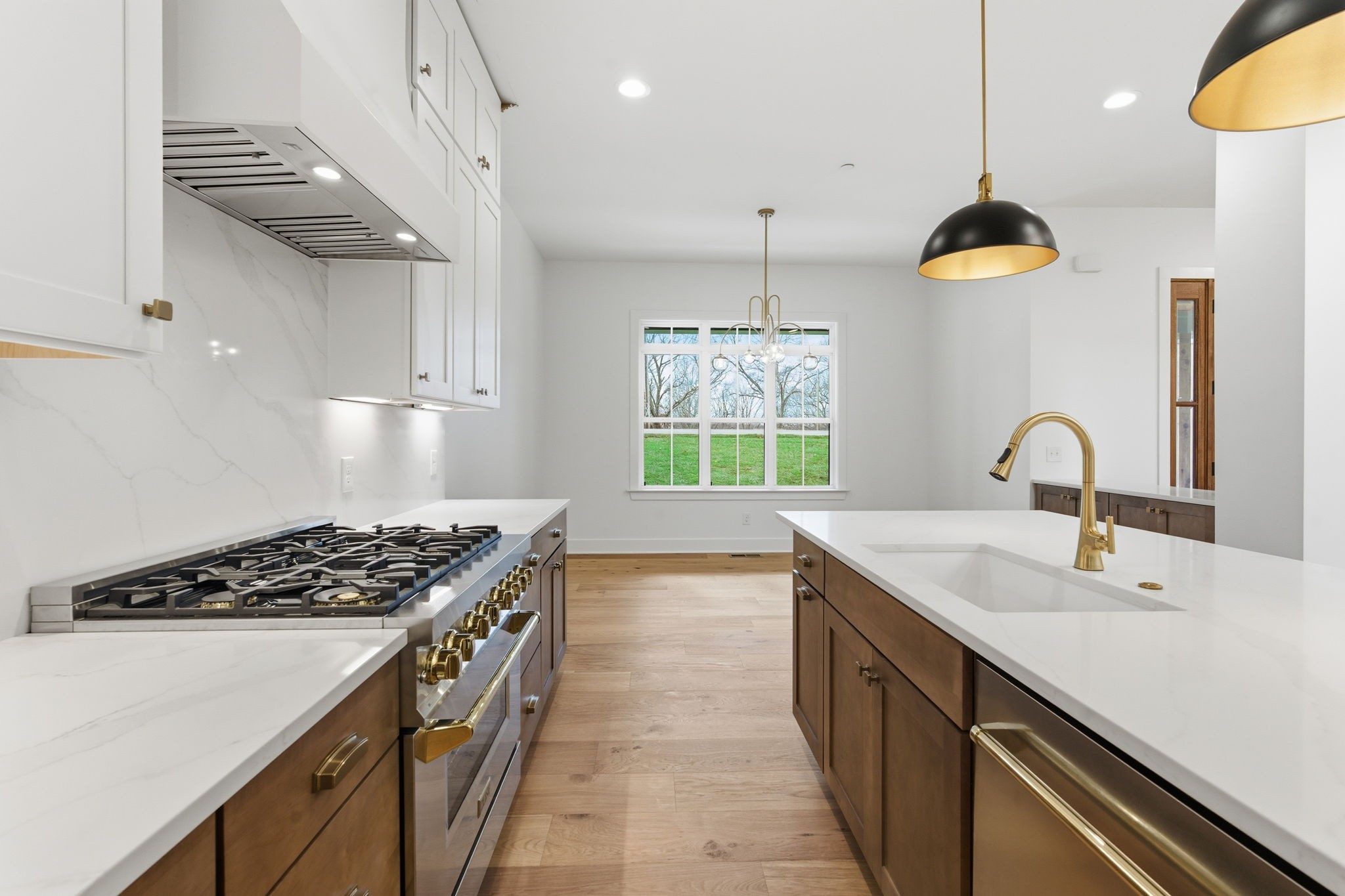 478 Mt Pleasant Road Kingston Springs, TN 37082 - Photo 15 of 59 a kitchen with stainless steel appliances a stove a sink and a wooden floors