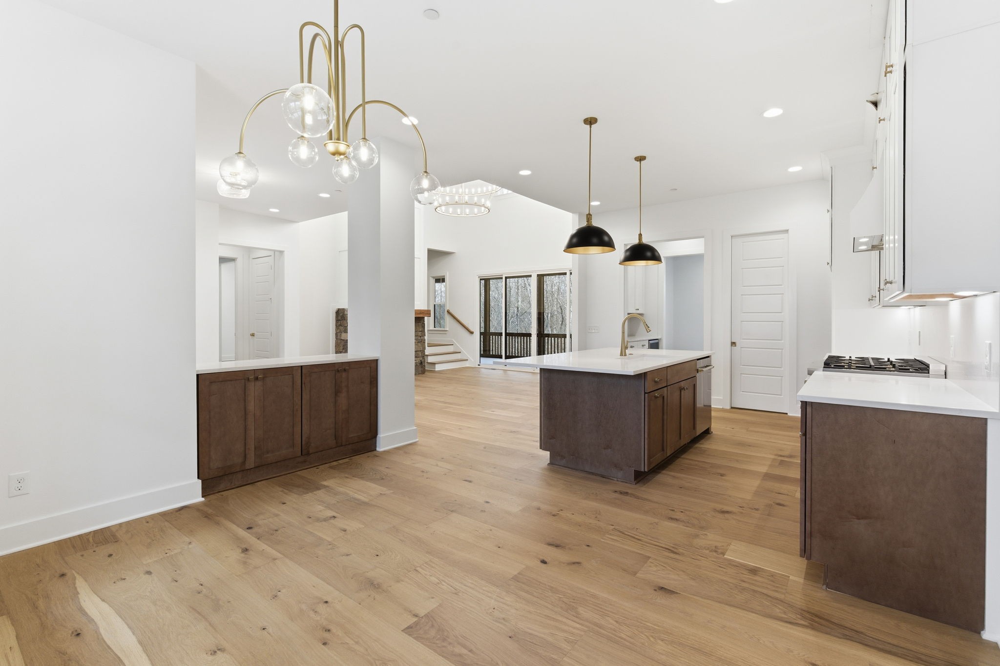 478 Mt Pleasant Road Kingston Springs, TN 37082 - Photo 17 of 59 a large room with kitchen island a sink a center island a stove a chimney and a window