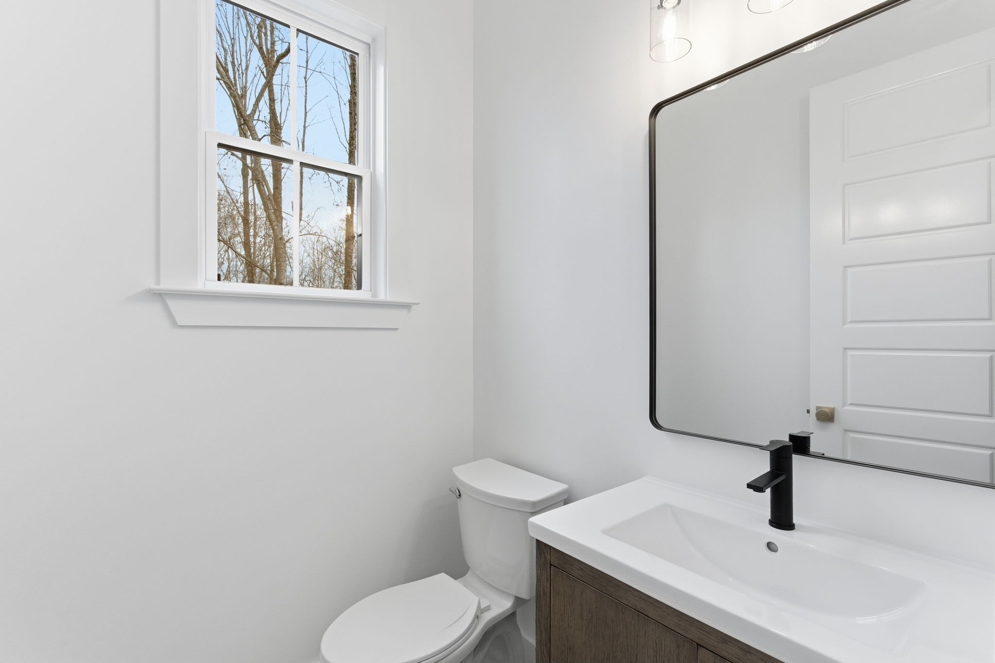 478 Mt Pleasant Road Kingston Springs, TN 37082 - Photo 20 of 59 a bathroom with a sink toilet and a mirror