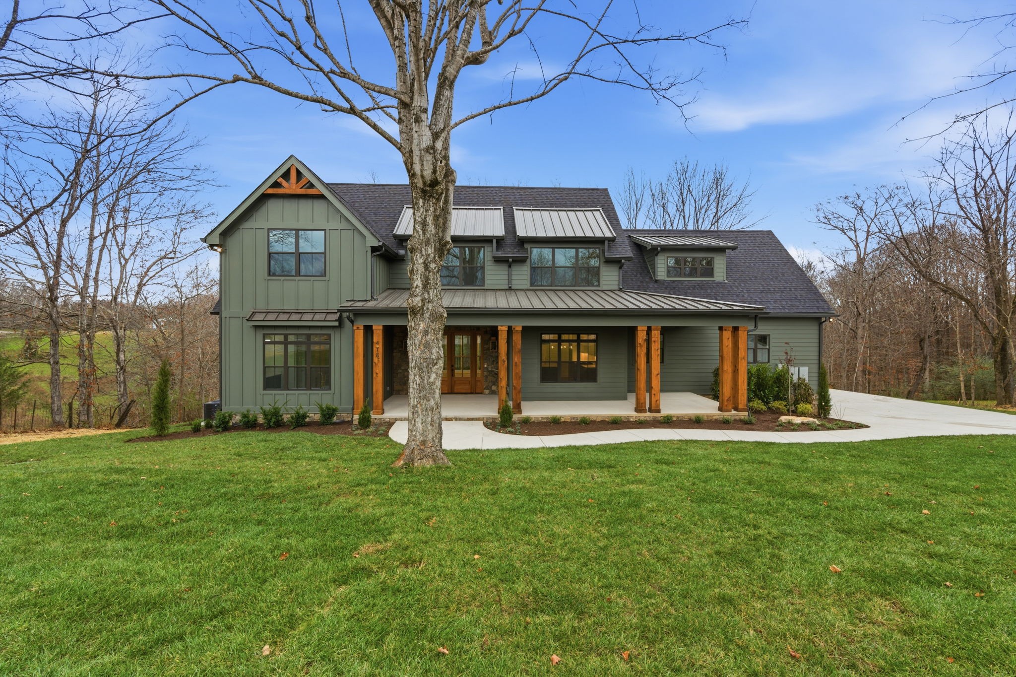 478 Mt Pleasant Road Kingston Springs, TN 37082 - Photo 2 of 59 a front view of a house with a yard