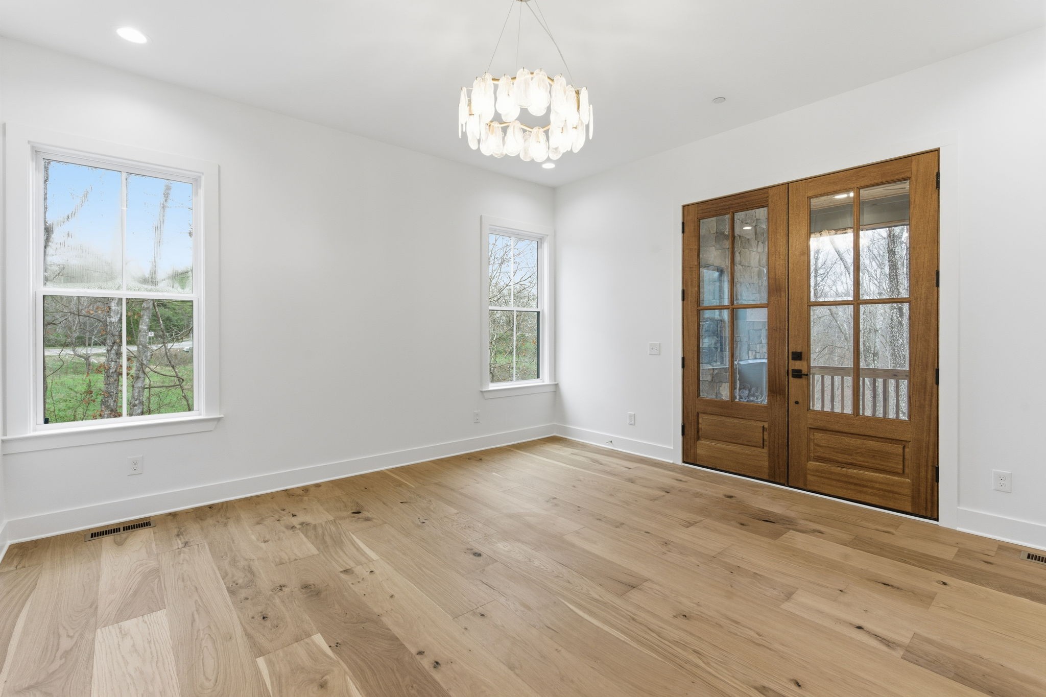 478 Mt Pleasant Road Kingston Springs, TN 37082 - Photo 21 of 59 a view of an empty room with wooden floor and a window