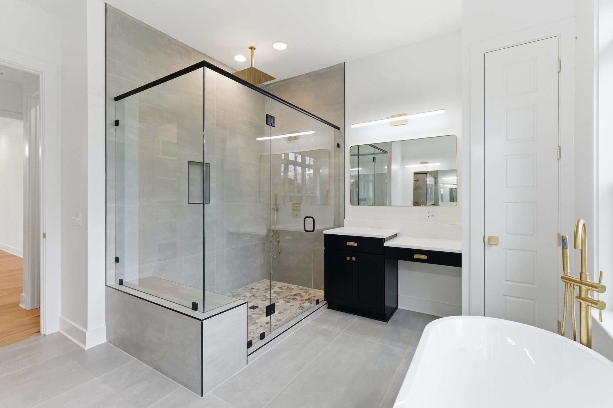 478 Mt Pleasant Road Kingston Springs, TN 37082 - Photo 26 of 59 a spacious bathroom with a bathtub shower sink and mirror