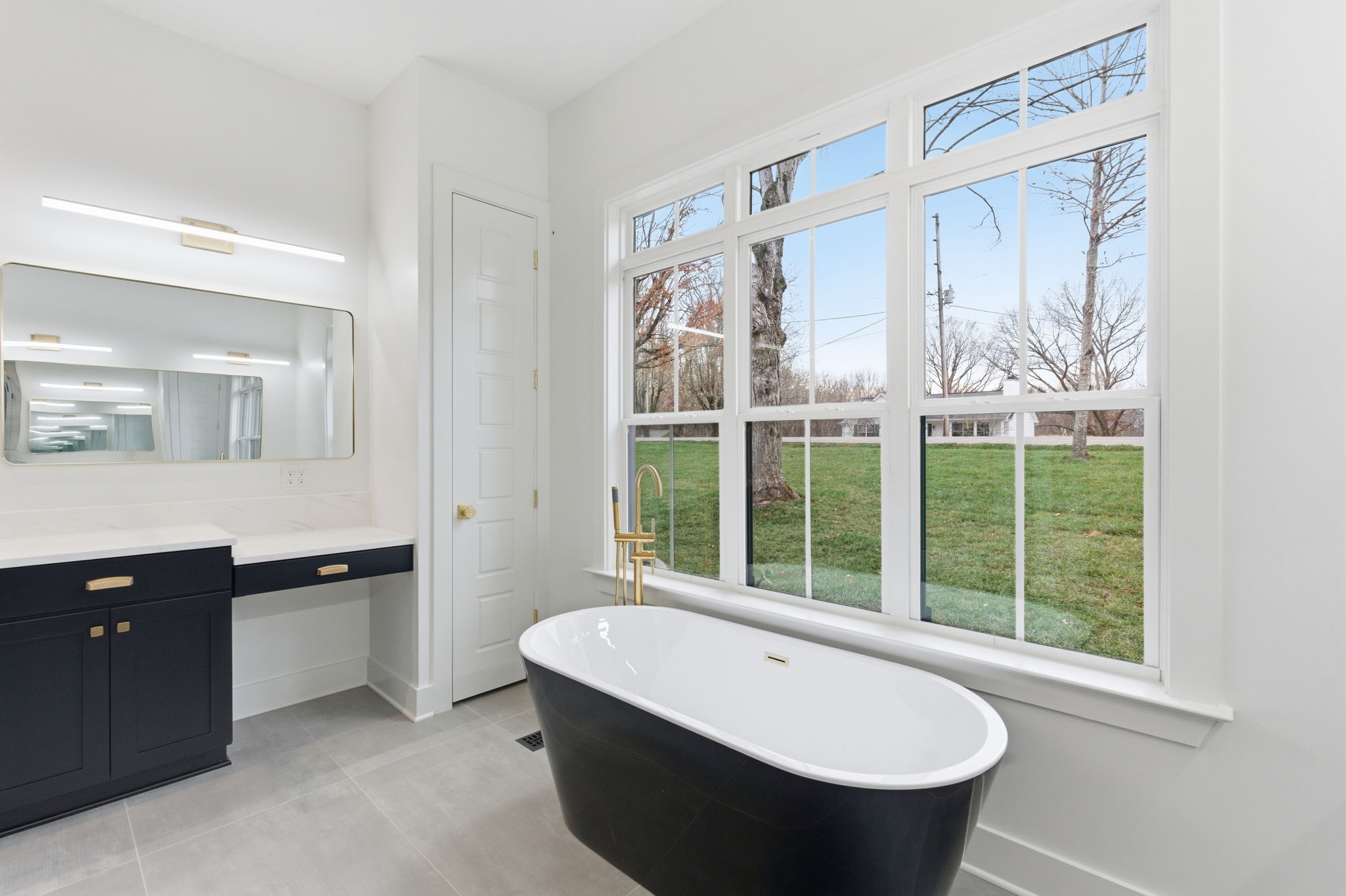 478 Mt Pleasant Road Kingston Springs, TN 37082 - Photo 28 of 59 a bathroom with a bathtub and a window