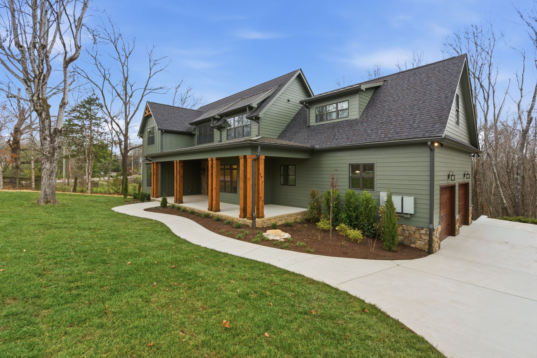 478 Mt Pleasant Road Kingston Springs, TN 37082 - Photo 3 of 59 a front view of a house with a yard