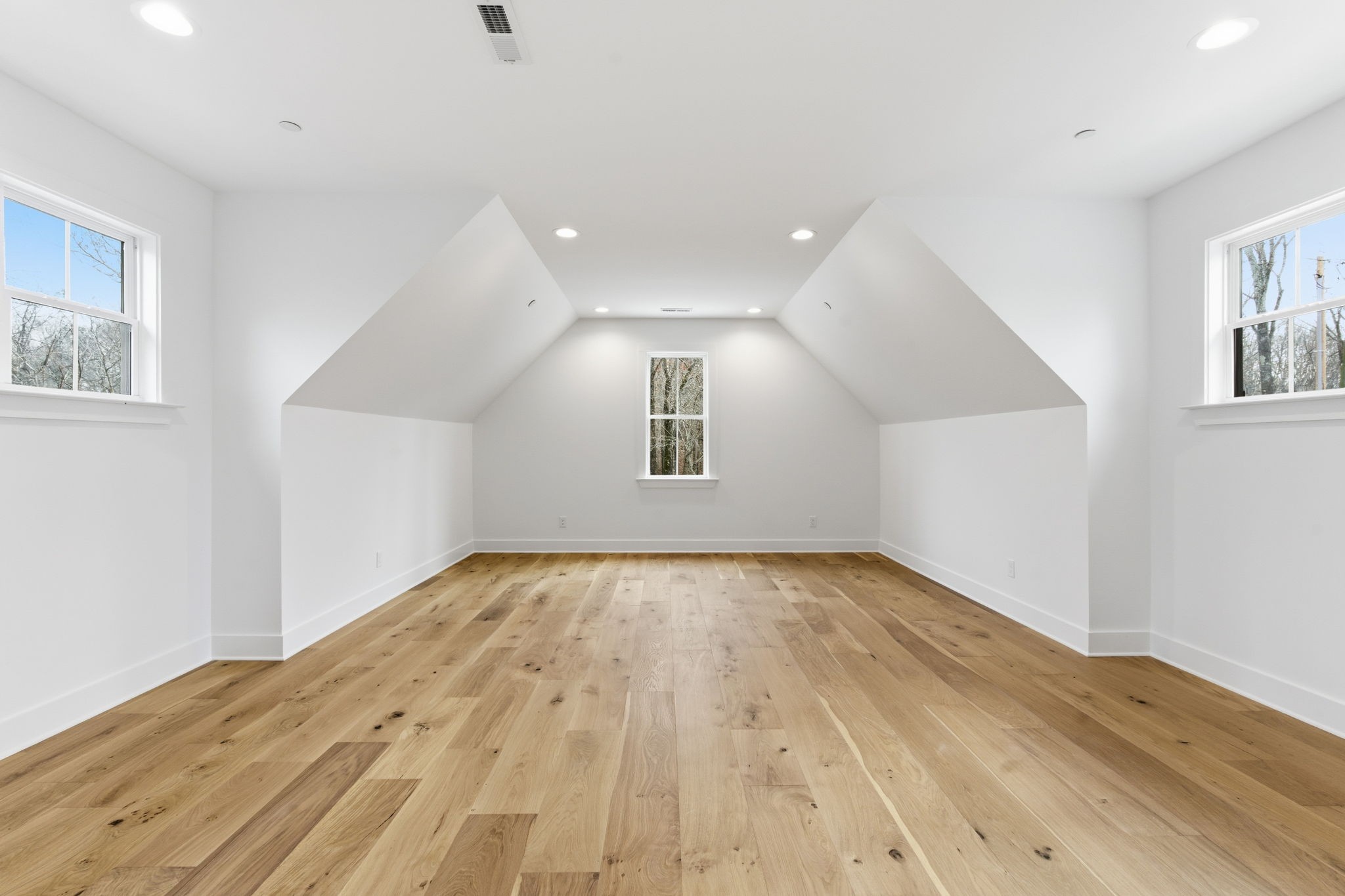 478 Mt Pleasant Road Kingston Springs, TN 37082 - Photo 39 of 59 a view of an empty room with wooden floor and a window
