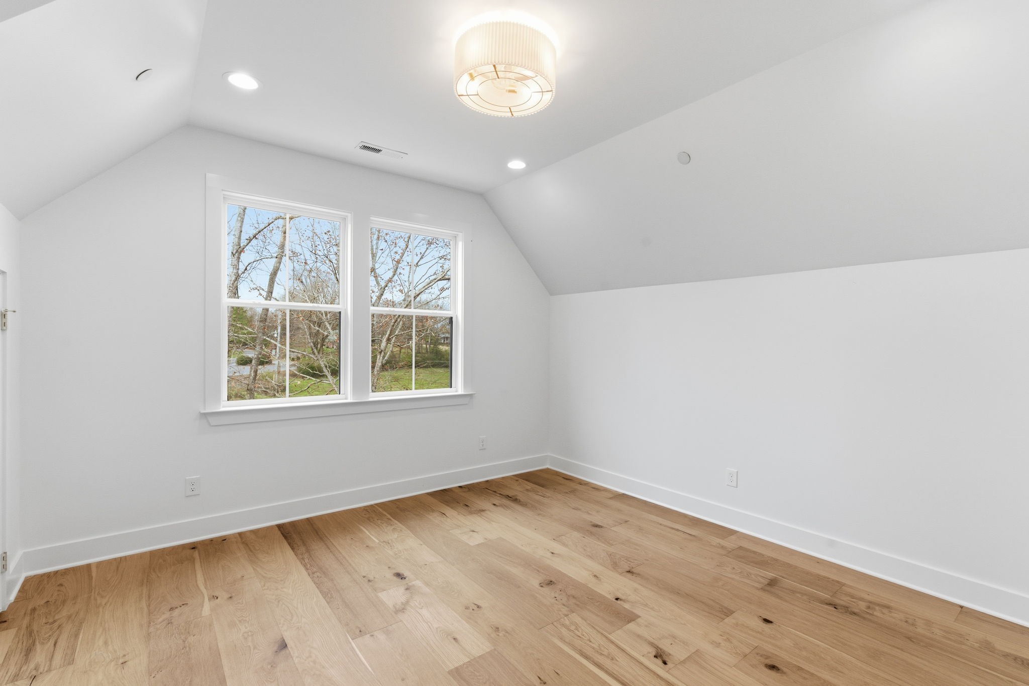 478 Mt Pleasant Road Kingston Springs, TN 37082 - Photo 43 of 59 an empty room with wooden floor and windows