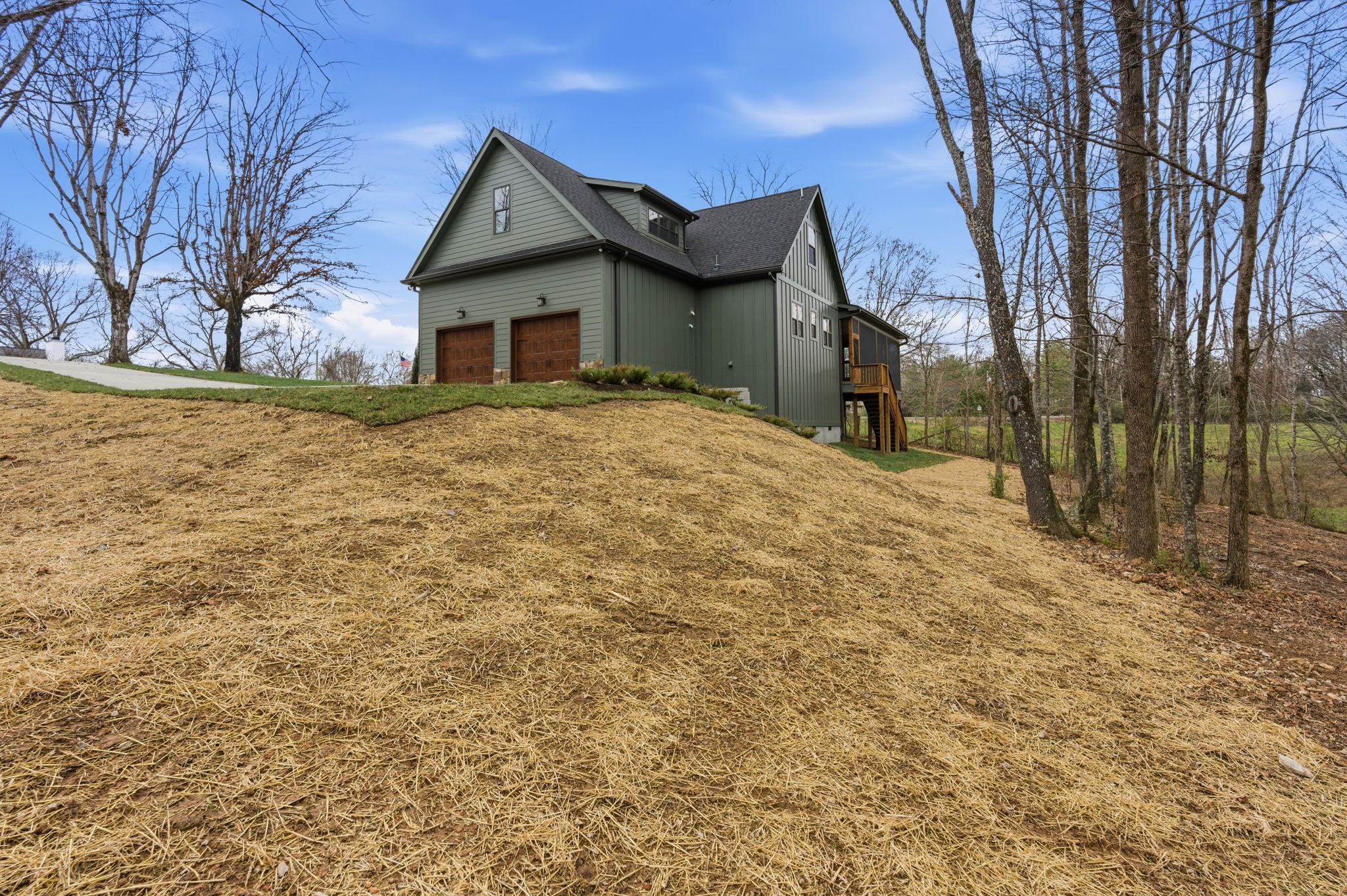 478 Mt Pleasant Road Kingston Springs, TN 37082 - Photo 51 of 59 a front view of a house with a yard and garage