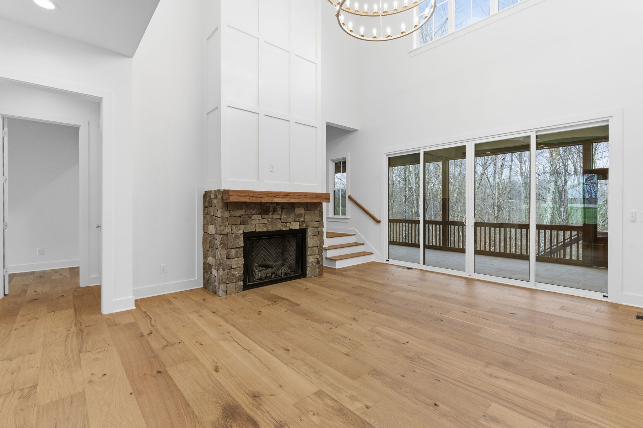 478 Mt Pleasant Road Kingston Springs, TN 37082 - Photo 10 of 59 a view of an empty room with wooden floor and a window