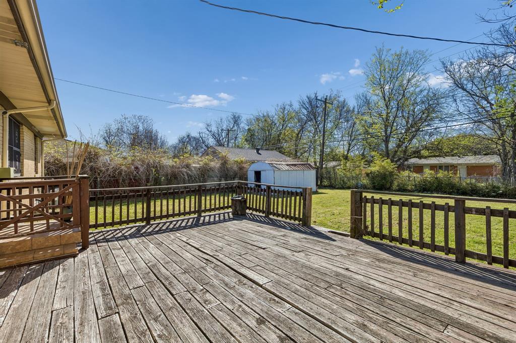2622 Centerville Road Dallas, TX 75228 - Photo 19 of 22 a view of a balcony with wooden floor and fence