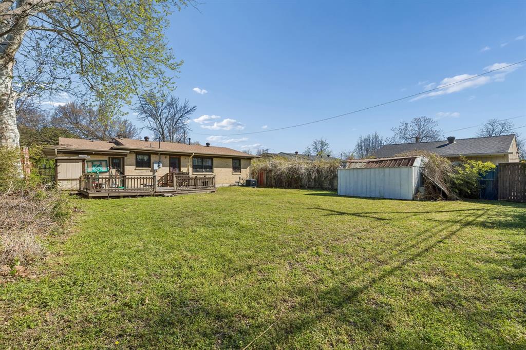 2622 Centerville Road Dallas, TX 75228 - Photo 20 of 22 a view of a house with a backyard