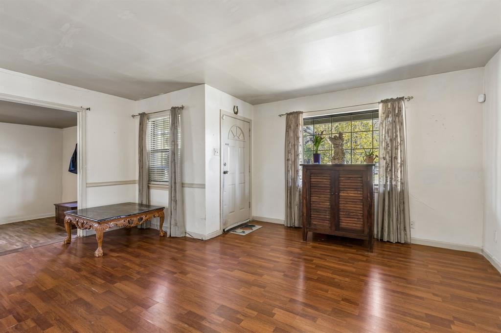 2622 Centerville Road Dallas, TX 75228 - Photo 3 of 22 an empty room with wooden floor and windows