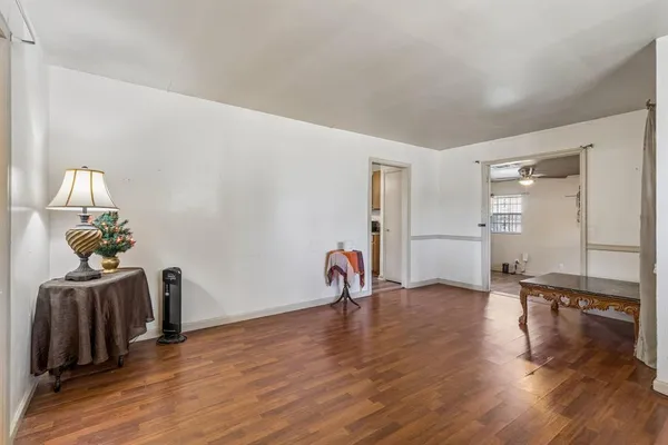 a view of a livingroom with wooden floor