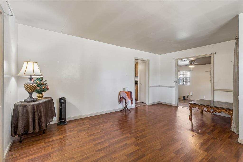 2622 Centerville Road Dallas, TX 75228 - Photo 4 of 22 a view of a livingroom with wooden floor