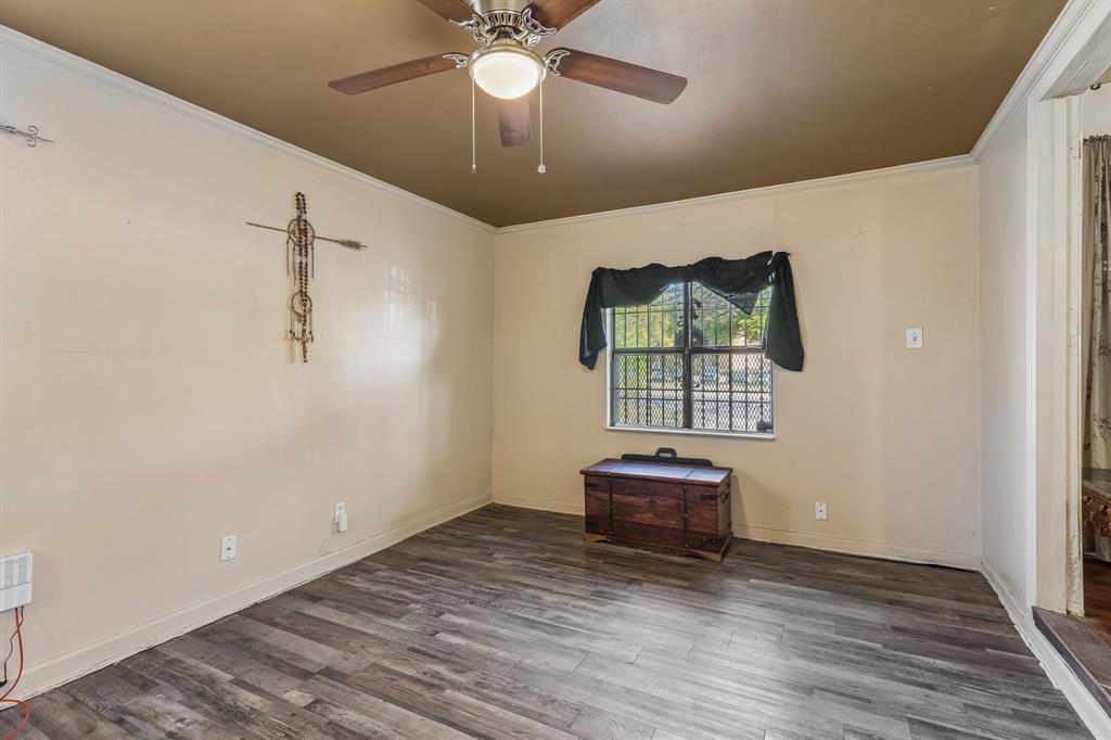 2622 Centerville Road Dallas, TX 75228 - Photo 10 of 22 wooden floor in an empty room with a window