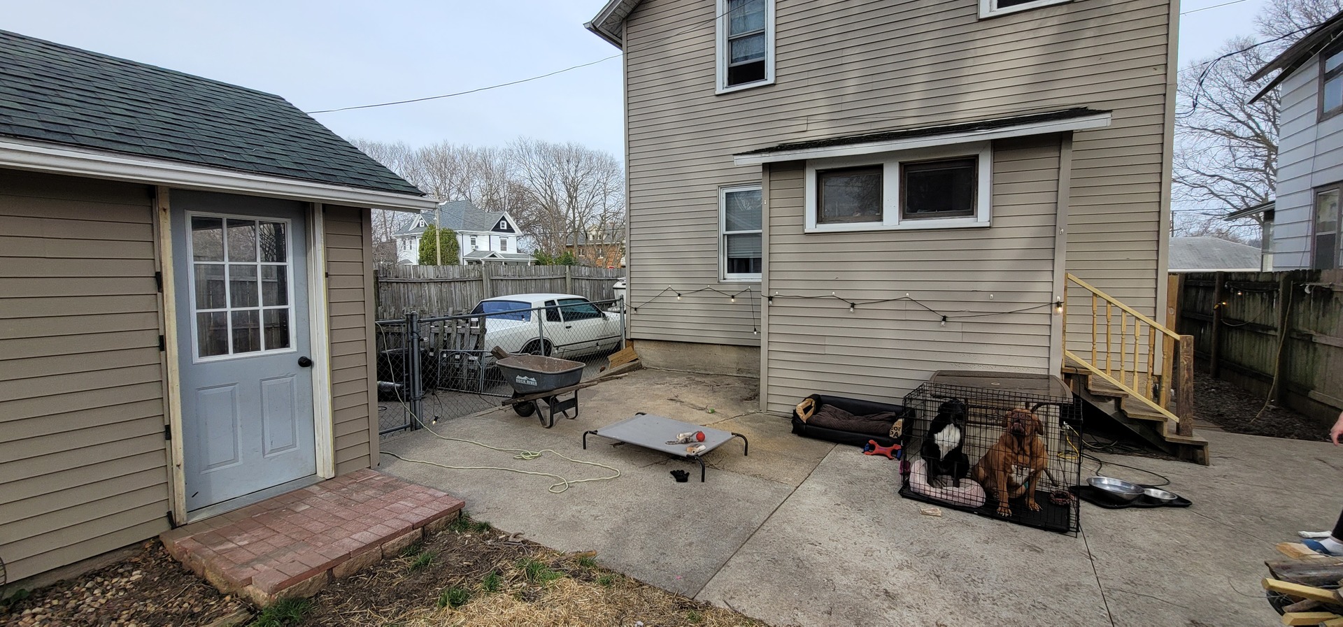 709 Ave C Sterling, IL 61081 - Photo 14 of 16 a backyard of a house with barbeque oven table and chairs