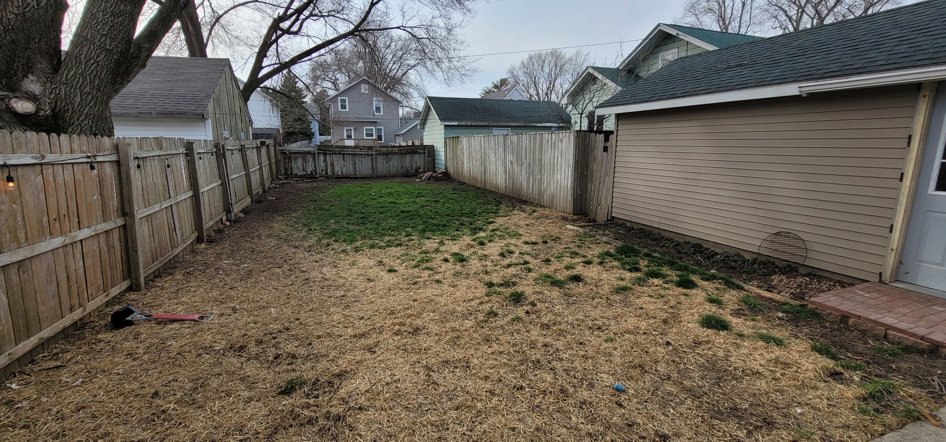 709 Ave C Sterling, IL 61081 - Photo 15 of 16 a view of a yard with wooden fence