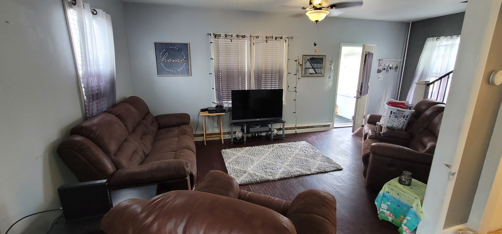 709 Ave C Sterling, IL 61081 - Photo 3 of 16 a living room with furniture and a flat screen tv