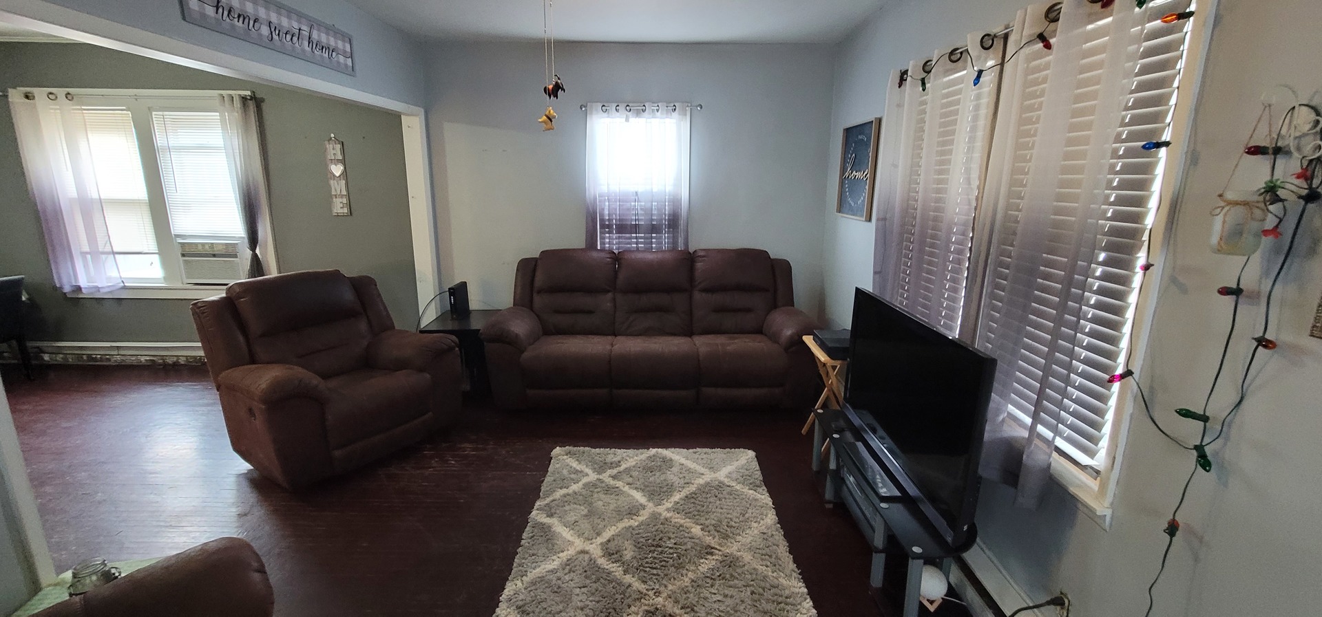 709 Ave C Sterling, IL 61081 - Photo 4 of 16 a living room with furniture and a window