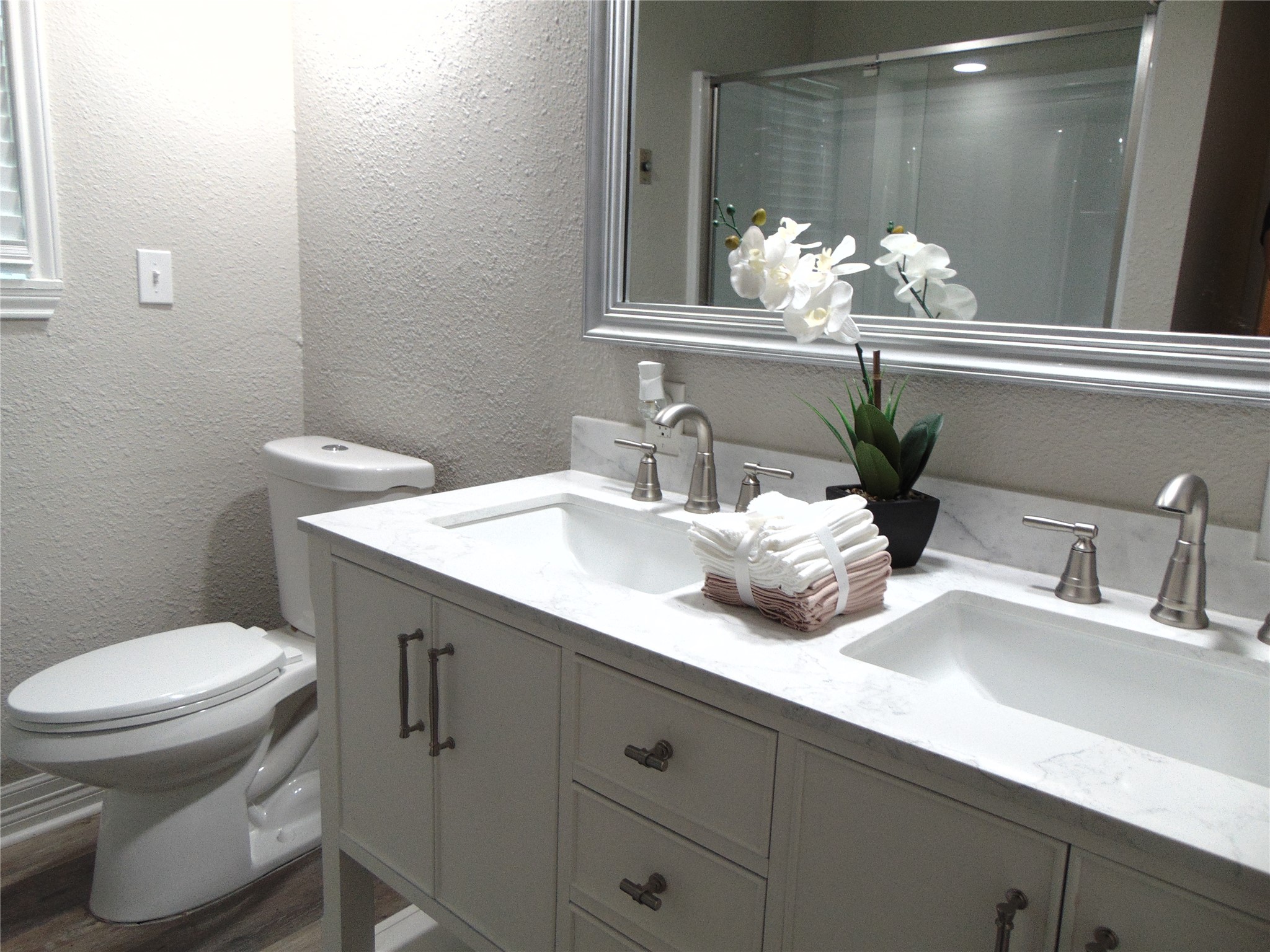 1702 Rampart Street Columbus, TX 78934 - Photo 35 of 38 Dual vanity with pristine countertops and ample storage elevate this private bathing sanctuary.
