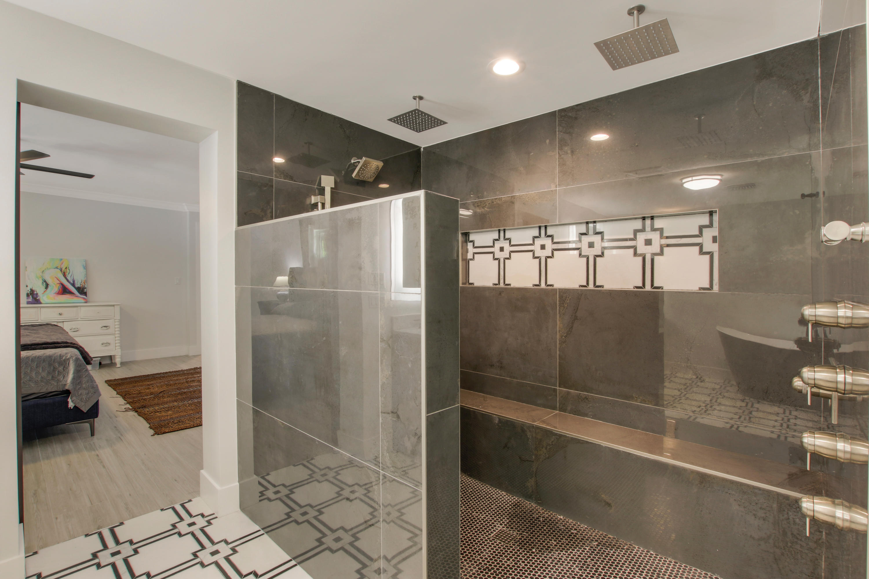 1150 Singer Drive Riviera Beach, FL 33404 - Photo 12 of 20 a bathroom with a glass shower door