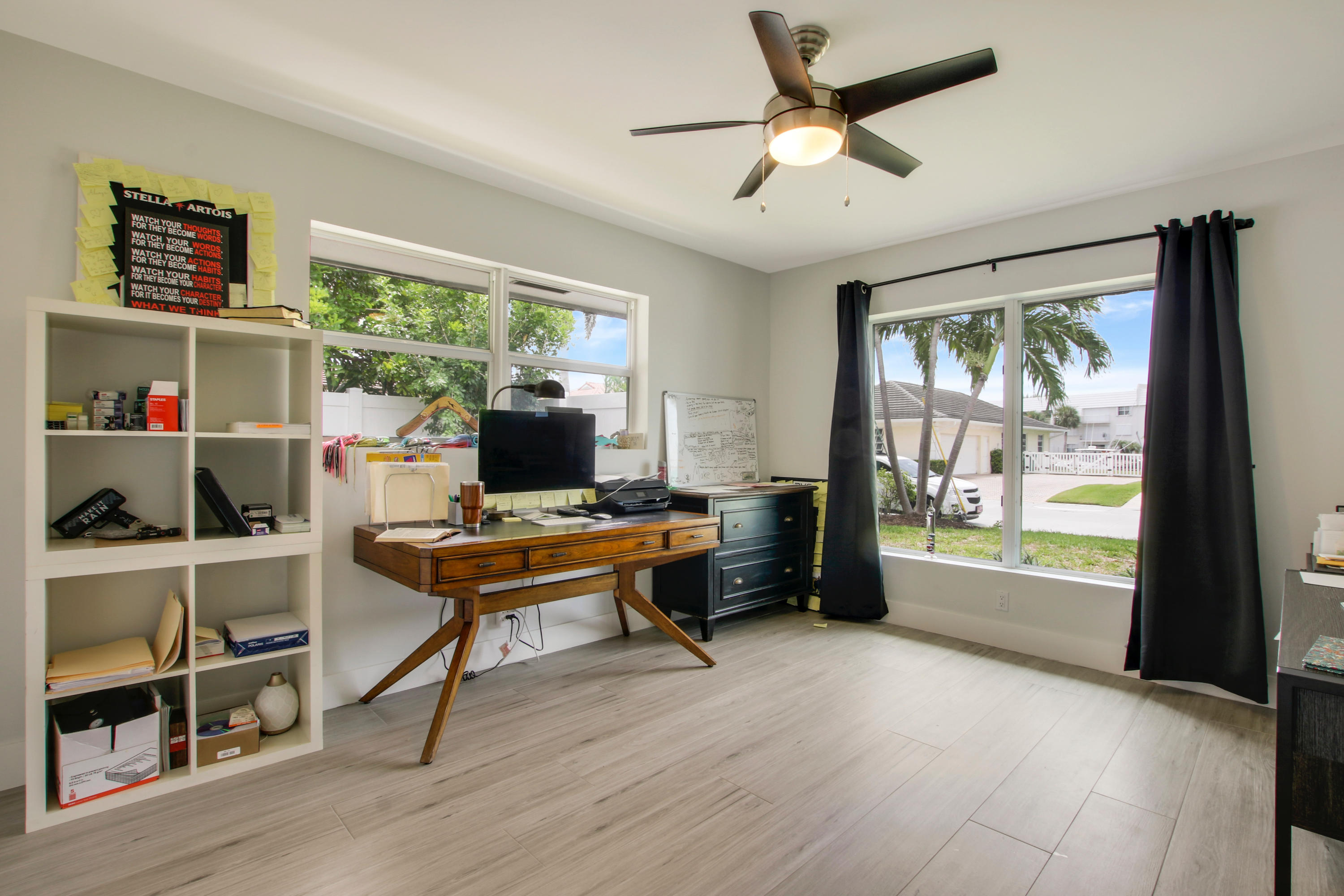 1150 Singer Drive Riviera Beach, FL 33404 - Photo 14 of 20 a living room with furniture a large window and wooden floor
