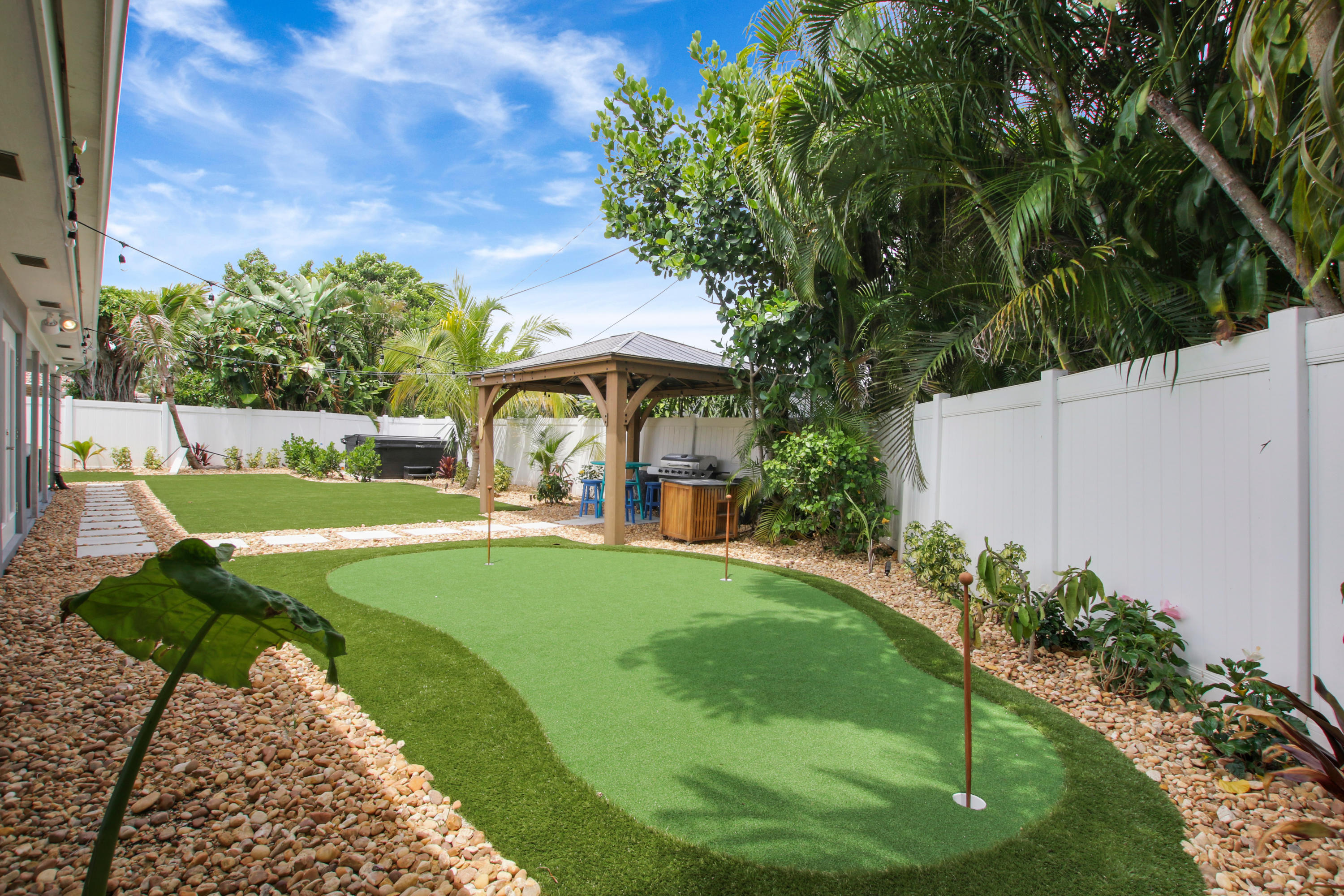 1150 Singer Drive Riviera Beach, FL 33404 - Photo 16 of 20 a view of a house with a yard