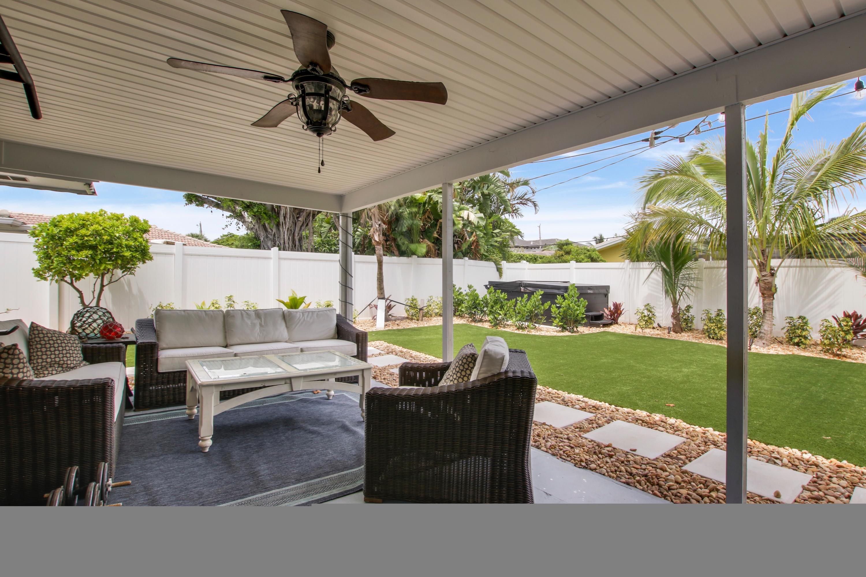 1150 Singer Drive Riviera Beach, FL 33404 - Photo 17 of 20 a outdoor living space with furniture and garden