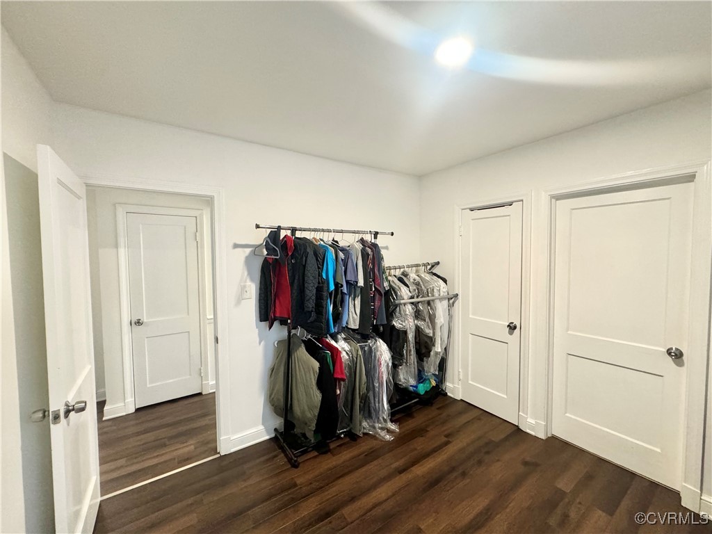 7300 Vernon Road Henrico, VA 23228 - Photo 14 of 20 Walk in closet featuring dark hardwood / wood-styl