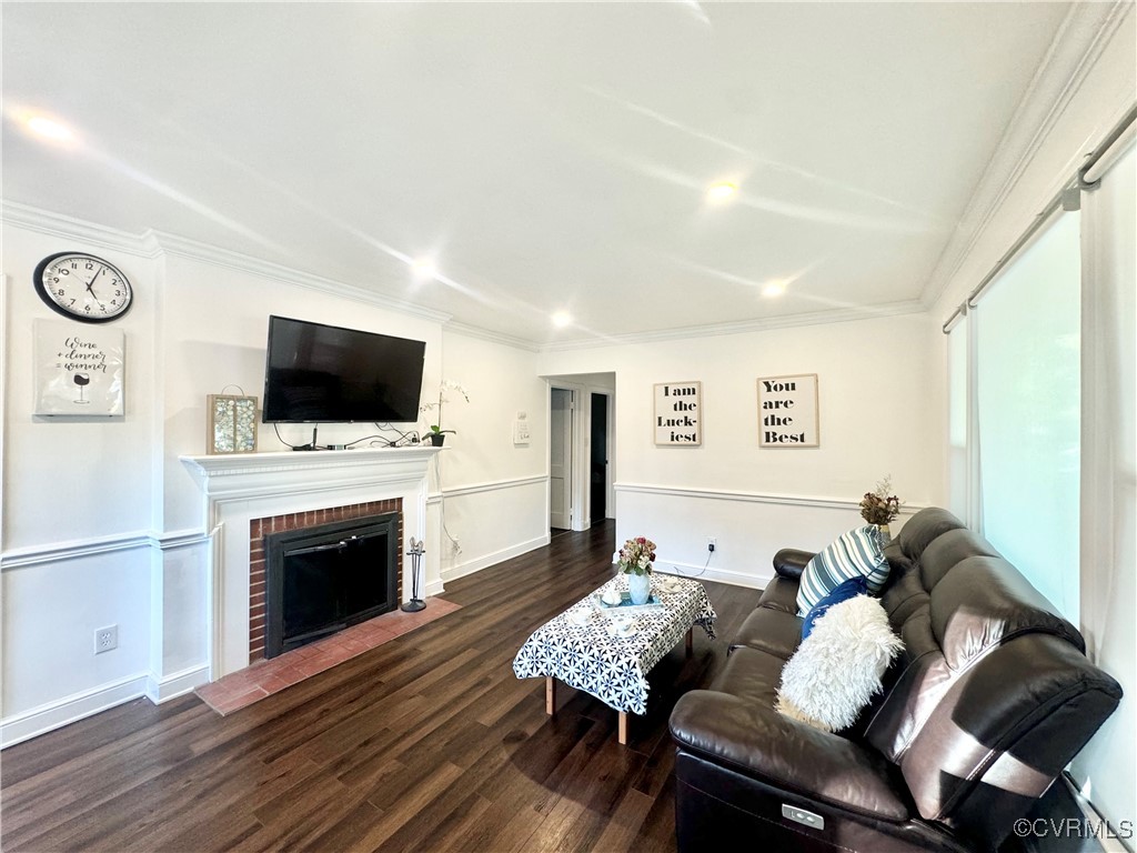 7300 Vernon Road Henrico, VA 23228 - Photo 6 of 20 Living room with crown molding, a fireplace, and d