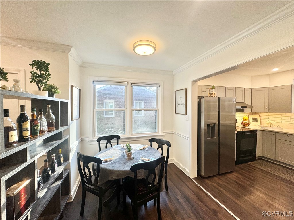 7300 Vernon Road Henrico, VA 23228 - Photo 9 of 20 Dining space with crown molding and dark hardwood