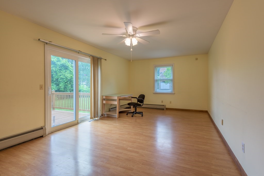 2 Wintergreen Circle Amherst, MA 01002 - Photo 12 of 37 a view of a livingroom with furniture window wooden floor and a ceiling fan