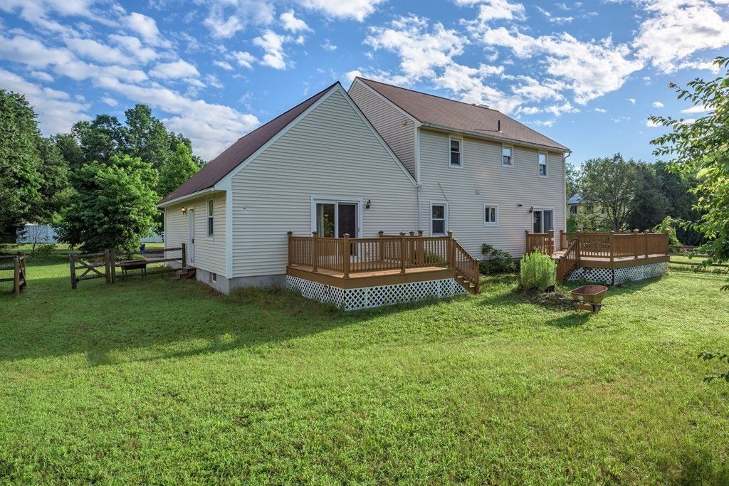 2 Wintergreen Circle Amherst, MA 01002 - Photo 35 of 37 a view of backyard of house with wooden deck and seating